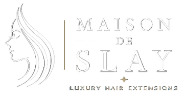 Maison de Slay logo with a stylized woman's face and text on a black background